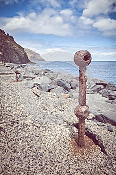 Old rusted piece of guard rail on a quay