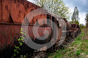 Old rusted steam locomotive abandoned at train cemetery