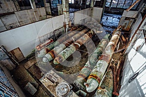 Old rusted submarine torpedoes in abandoned torpedo factory