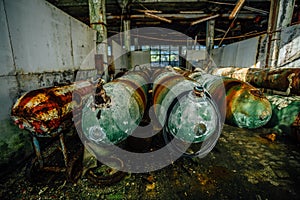 Old rusted submarine torpedoes in abandoned torpedo factory