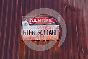 Old voltage warning sign photo