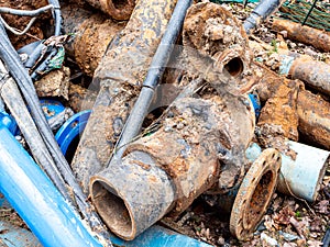 Old rusted water pipes on a construction site