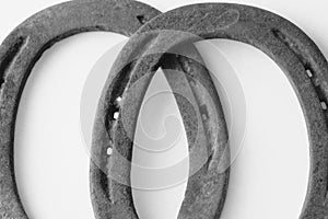 Old rustic horseshoes closeup in black and white