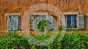 Old rustic house with a focus on wooden windows