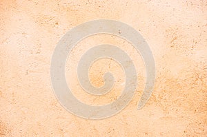 Beige colored wall plaster background texture