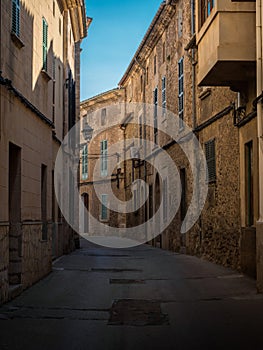 Old rustic mediterranean traditional house facade wall narrow alley lane road street Mallorca Balearic Islands Spain