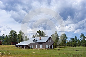 Old Rustic Mountain Cabin Ranch Under Storm Clouds