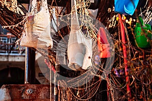 Old rustic sack bags hanging on dead tree