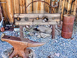 Old Rustic stocks and anvil Shack with Antique junk all around