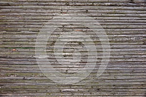 Old Rustic Weathered Fence From Natural Unpainted Dry Wood Surface photo