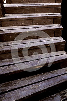 Old rustic wooden stairs in the garden