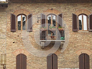 Old Rustique Brick Wall with Flowered Balcony