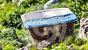 Old, rusty and abandoned bathtub in the countryside