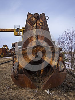 Old rusty abandoned building gantry crane on rusty rails. Abandoned container loading construction warehouse. Dead Zona photo