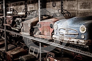 Old and rusty abandoned pedal cars for kid