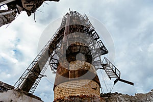 Old rusty abandoned rectification column, bottom view