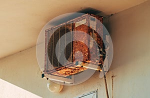 Old rusty air conditioner external unit