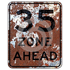 Old rusty American road sign - 35 zone ahead