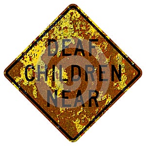 Old rusty American road sign - Deaf children near, California