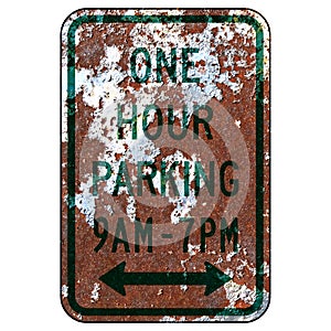 Old rusty American road sign - One hour parking