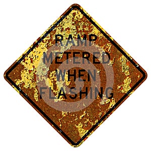 Old rusty American road sign - Ramp metered when flashing