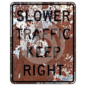 Old rusty American road sign - Slower traffic keep right photo