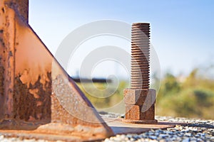 Old rusty anchor bolt with iron plate - image with copy space