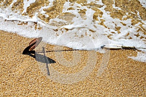 Old rusty anchor in the sand