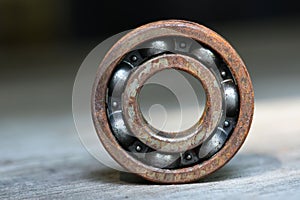 old and rusty ball bearing with grease stain