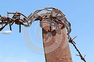 Old rusty barbed wire fence