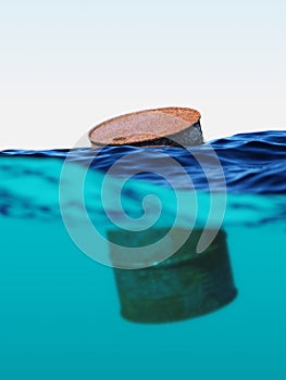 Old rusty barrel floating on the waves