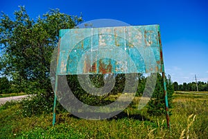 Old rusty billboard in ghost town Pripyat Chornobyl Zone photo