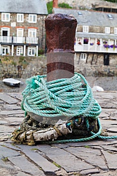 An old rusty bollard on a quayside