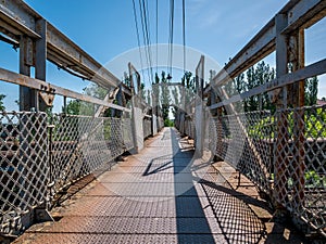 Old rusty bridge over the railroad