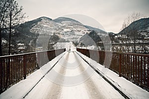 Old rusty bridge under snow