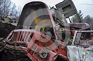 Old rusty broken and damaged abandoned Soviet fire truck on scrap metal recycling yard