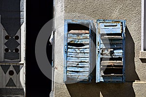 Old rusty broken mailboxes on the wall