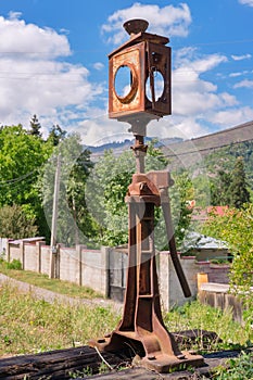 Old rusty broken semaphore on the railway