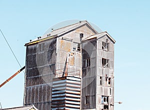 Old and rusty building against a blue sky