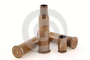 Old rusty bullet casings on a white background