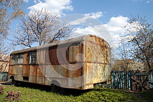 Old rusty bus in the garden