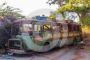 Old rusty bus partly collapsed