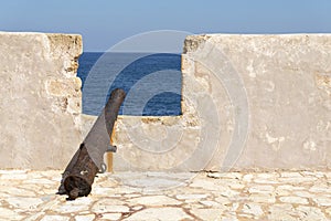 Old rusty cannon at the fortress of Firka. Greece.