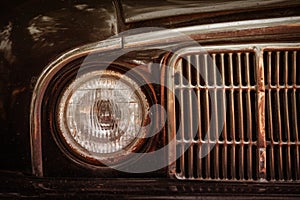 Old rusty car bumper and lamp