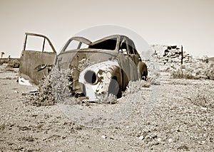 Old rusty car in the desert