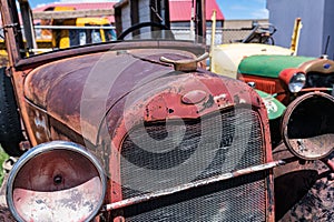 Old rusty car in junkyard