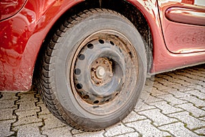 Old rusty car wheel disc