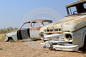 Old and rusty car wreck at the last gaz station before the Namib desert