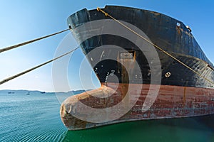 Old, rusty, cargo vessels` bow.