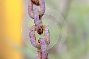 Old rusty chain with thick links .